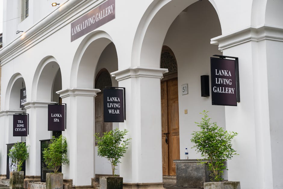 Charming architectural shot of Lanka Living Gallery showcasing elegant arches and greenery.